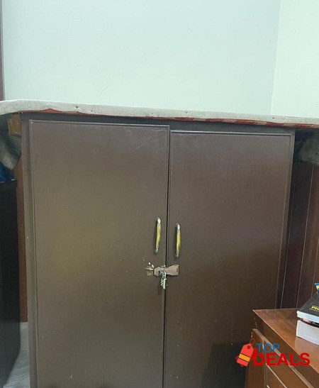 Iron table with attached cupboard image 2